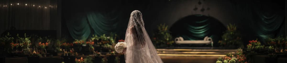 Bride standing before a wedding stage