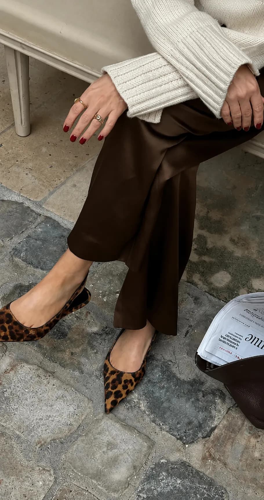 Wardrobe styling detail with shoes and folded knitwear